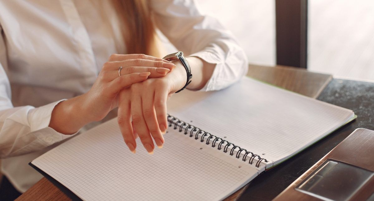 time management-woman looking at her watch